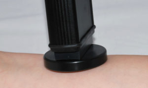 Dia-Stron TLS translucency meter, where the probe is being held vertically against the inside of a forearm