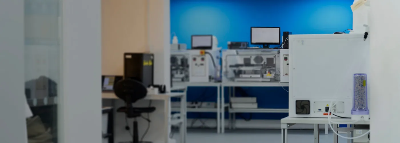 a modern hair and fibre testing laboratory with various computers and equipment